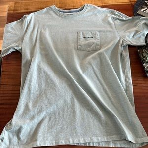 Baby blue colored Patagonia pocket T-Shirt. Lightly worn.